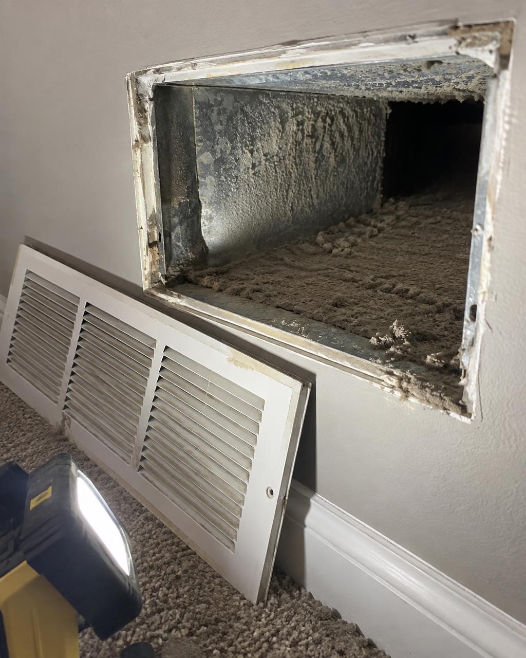 Return air duct opened up during a service call, thick dust built up inside